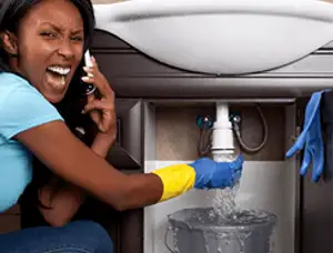 Emergency plumbing repair for a leaking sink drain under a bathroom vanity in Berkeley, CA
